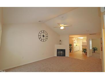 Bright living room featuring a fireplace, vaulted ceiling and ceiling fan at 11370 Clubhaven Pl # 103, Raleigh, NC 27617