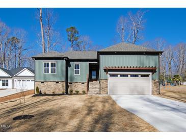 Craftsman style home with gray siding, stone accents and 2-car garage at 240 Sequoia Dr, Louisburg, NC 27549