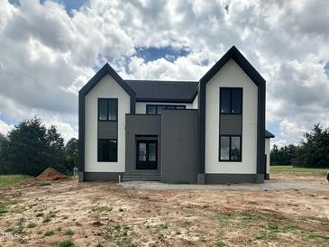Striking new construction home with black framed windows and a modern color scheme at 280 Forest Bridge Rd, Franklinton, NC 27525