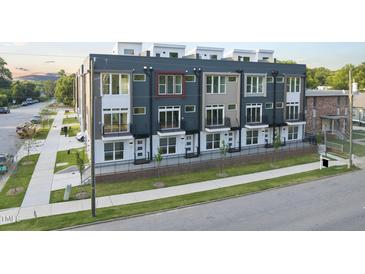 Modern multi-story townhomes featuring a variety of exterior finishes and private balconies at 10 Seawell Ave # 102, Raleigh, NC 27601