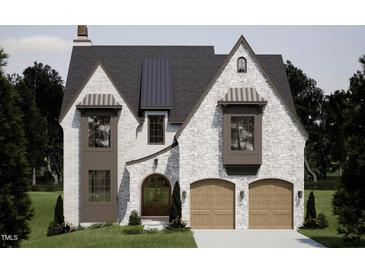 Beautiful stone home featuring a modern design, arched entry, and a symmetrical roofline at 1306 Lennox Pl, Raleigh, NC 27612