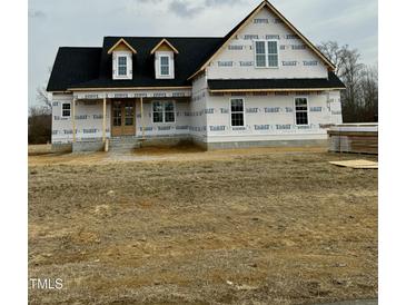 Newly constructed craftsman style home with a wrap around porch at 5601 River Buck Rd, Spring Hope, NC 27882