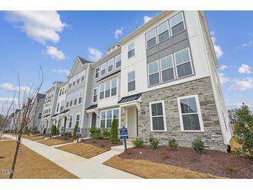 New townhome community with multiple units, stone and gray siding at 444 Billingshurst Way, Knightdale, NC 27545