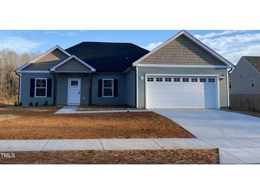 Charming single-story home with a two-car garage and inviting front porch at 286 Yellowwood Ave, Spring Hope, NC 27882