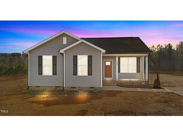 Gray exterior of charming one-story home with red door and landscaping at 145 Brookhaven Dr, Spring Hope, NC 27882