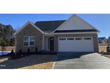 Brick ranch home with two-car garage and landscaping at 55 Sawtooth Oak Ln, Youngsville, NC 27596