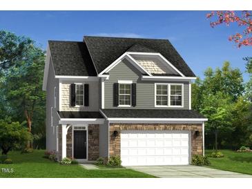 Charming two-story home featuring stone accents, gray siding, and a welcoming front entrance at 609 Chopper Ln # Homesite 10, Durham, NC 27703