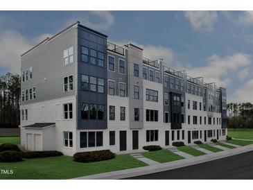 Contemporary townhome exterior showcasing a modern design, gray and white paint scheme, and well-maintained landscaping at 10535 Pleasant Branch Dr # 201, Raleigh, NC 27614