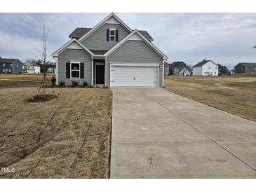 Charming new construction home with two-car garage and long driveway on a large lot at 178 Vili Dr, Broadway, NC 27505