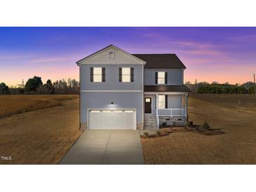 Charming two-story home with a front-facing garage and a welcoming front porch at 55 Diamond Creek Dr, Zebulon, NC 27597