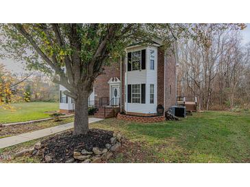 Brick home with walkway, landscaping, and deck at 208 Mallard Creek Dr # B, Graham, NC 27253