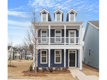 Charming two-story home with a front porch and classic architectural details at 672 Georgia'S Landing Pkwy # 69, Raleigh, NC 27603