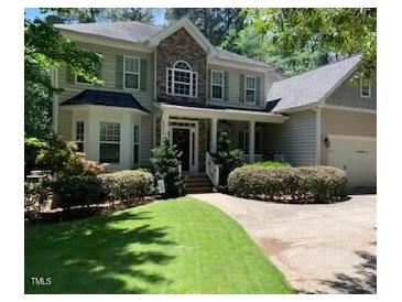 Two-story house with stone accents and landscaping at 1620 Dunn Rd, Raleigh, NC 27614