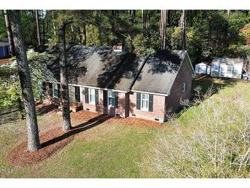 Charming single-story brick home featuring a classic design and well-maintained landscaping at 3540 Chelsea Dr, Rocky Mount, NC 27803
