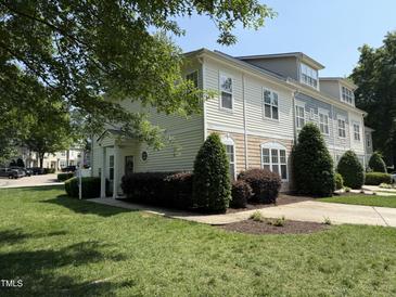 Charming townhouse with well-manicured landscaping and inviting front entrance at 526 Elm Ave, Wake Forest, NC 27587
