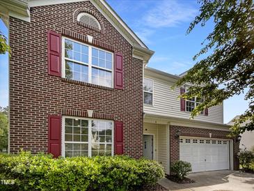 Charming two-story brick home with red shutters and a well-maintained front yard at 6 Heatherford Ct, Durham, NC 27704