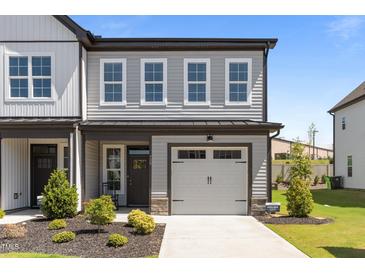 Charming home featuring a one-car garage, well-maintained landscaping, and a welcoming front entrance at 709 Jamescroft Way, Rolesville, NC 27587