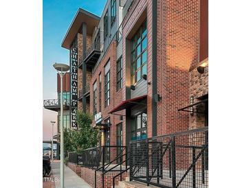 Chatham Park apartments shows brick facade and modern architectural details for luxury living experience at 120 Mosaic Blvd # 307, Pittsboro, NC 27312