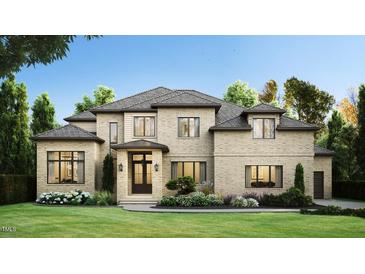 Two-story house with brick exterior, gabled roof and landscaping at 9125 Overlook Crest Dr, Wake Forest, NC 27587