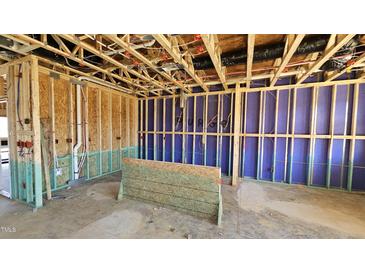 An in-progress view of a framed interior, showcasing the home's construction and infrastructure at 3852 Well Fleet Drive, Willow Springs, NC 27592