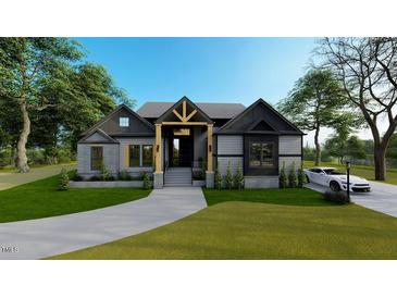 Two-story home with gray siding, a modern design, and a landscaped lawn at 45 Quail Pt, Pittsboro, NC 27312