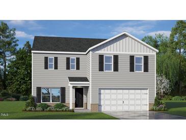 Charming two-story home featuring gray siding, black shutters, and a two-car garage at 113 Reagan Crest Dr, Clayton, NC 27520