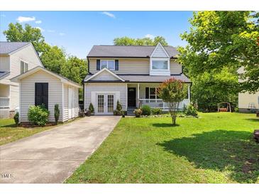 Charming two-story home with a well-manicured lawn and a detached garage at 4708 River Boat Landing Ct, Raleigh, NC 27604