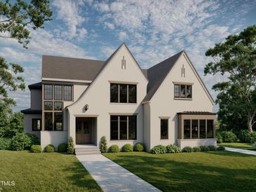 Stunning new construction home with a manicured lawn, large windows, and a modern design at 5101 Olde South Rd, Raleigh, NC 27606