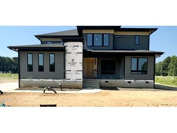 Modern two-story home with gray siding and black trim at 130 Broadleaf Ln, Youngsville, NC 27596
