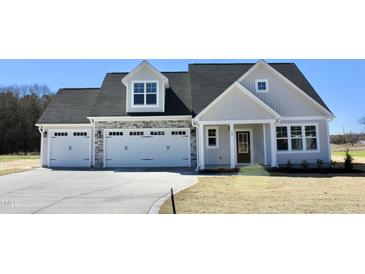 Beautiful two-story home with a three-car garage and stone accents at 48 Surles Landing Way, Benson, NC 27504