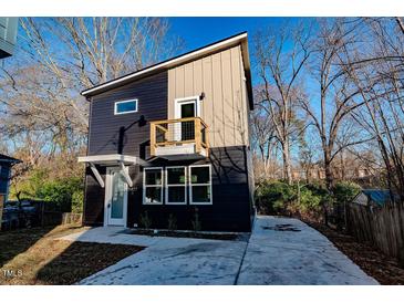 Modern two-story home with dark exterior and balcony at 2407 Hart Street # B, Durham, NC 27703