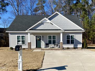 Charming one-story house with gray siding and a welcoming front porch at 26 Wildberry Ct, Rocky Mount, NC 27804