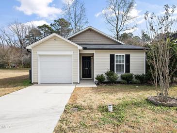Cute one-story house with attached garage and landscaped yard at 801 Thornberry Ct, Spring Hope, NC 27882
