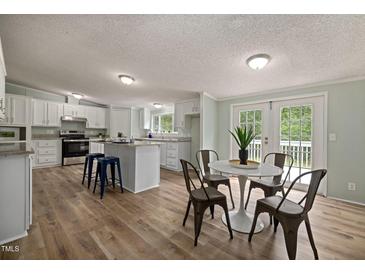 Spacious kitchen featuring modern appliances and an island at 8225 Fieldcrest Ln, Fuquay Varina, NC 27526