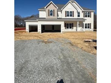 Beautiful new two story home with a three car garage and neutral colored accents at 145 Surles Landing Way, Benson, NC 27504