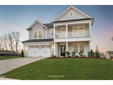 Two-story home with gray siding, white trim, and a two-car garage at 1783 Ballard Rd # Apex Georgian, Fuquay Varina, NC 27526