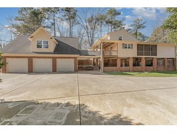 Brick house with attached garage and large deck at 6301 King Lawrence Rd, Raleigh, NC 27607