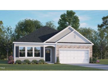 Newly constructed home with a two-car garage and landscaped yard at 155 Scenic Rock Dr, Youngsville, NC 27596