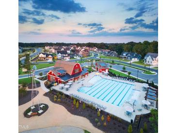 Aerial view of Serenity community with pool, clubhouse, and homes at 313 Inspiration Way Way, Fuquay Varina, NC 27526