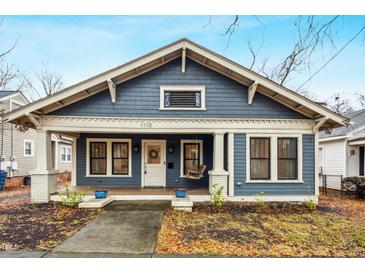 Charming blue house with white trim, front porch, and landscaping at 1110 N Buchanan Blvd, Durham, NC 27701