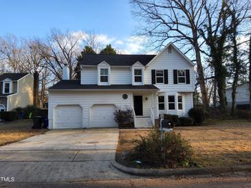 Two-story house with attached two-car garage and a well-maintained lawn at 4300 Hickory Ridge Dr, Raleigh, NC 27609