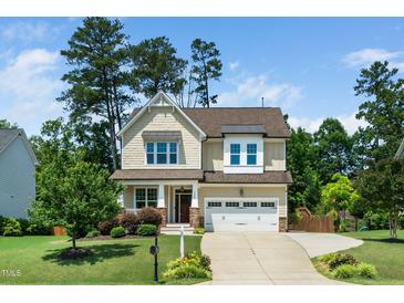 Charming two-story home with a well-manicured lawn and inviting curb appeal at 4538 Brighton Ridge Dr, Apex, NC 27539