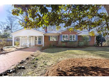 Brick ranch home with landscaped yard and walkway at 3726 Randolph Rd, Durham, NC 27705