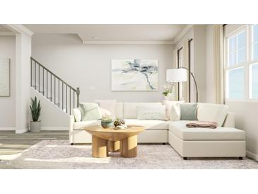 Bright living room featuring a comfy sectional sofa and a stylish coffee table at 1848 Poe Farm Ave, Apex, NC 27502