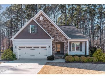 Charming Craftsman style home with stone accents and a two-car garage at 201 Laurel Oaks Dr, Youngsville, NC 27596