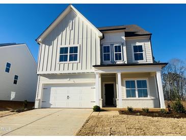 Two-story house with white siding, gray accents, and a two-car garage at 4327 Emeline Way # 10, Fuquay Varina, NC 27526