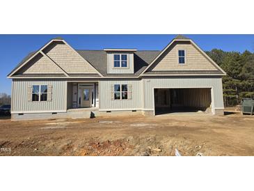 New construction home with two-car garage and attractive exterior at 129 Lassiter Ridge Dr, Four Oaks, NC 27524