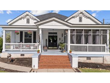 Charming front porch features brick steps, welcoming decor, and a cozy, inviting atmosphere at 400 S Boddie St, Nashville, NC 27856