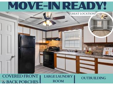 Bright kitchen features updated appliances and ample cabinetry at 408 W Main St, Pine Level, NC 27568