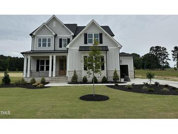 Charming two-story home with manicured lawn and landscaping at 190 Broadleaf Ln, Louisburg, NC 27549